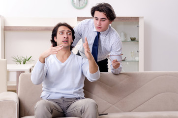 Young male patient discussing with psychologist personal problem