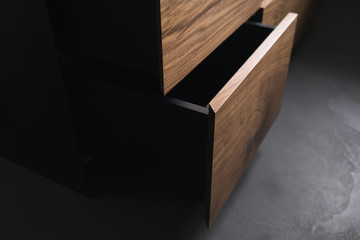 Closeup details of modern tv stand made from walnut and powder coated steed