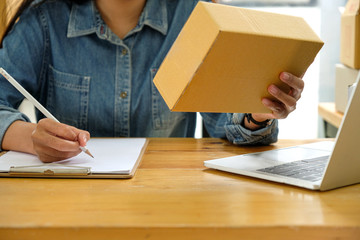 Staff are checking the package and taking notes.