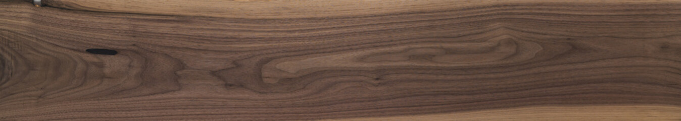 Obraz premium Black walnut wood texture of long solid board untreated