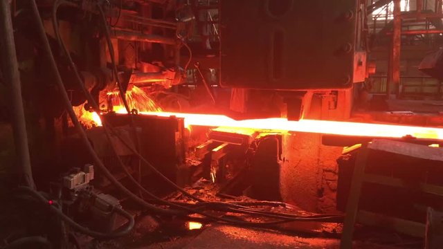 hot metal is pushed out of a metallurgical furnace, metal production, metallurgy, rolling mill
