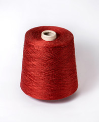 bobbin of yarn on a white background. Side view.Textile reel on isolated white background.