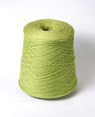 bobbin of yarn on a white background. Side view.Textile reel on isolated white background.