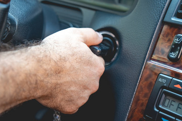 Man's hands to take the keys to start the engine car