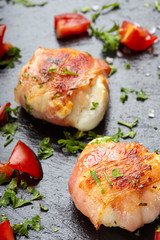 Fried goat cheese covered with smoked bacon