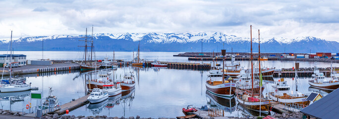 Iceland, Husavic town location. Picturesque panoramic view of northern town Husavik, old harbor...