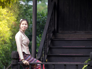 Fototapeta premium Thai Women in Traditional Costume Of Thailand, Ancient House Chiangmai North of Thailand Lanna
