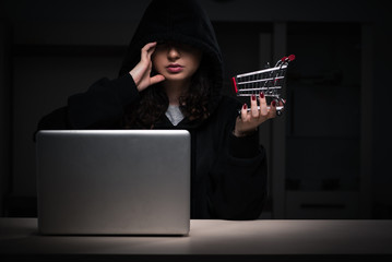 Female hacker hacking security firewall late in office