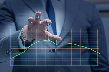 Businessman controlling the market with strings