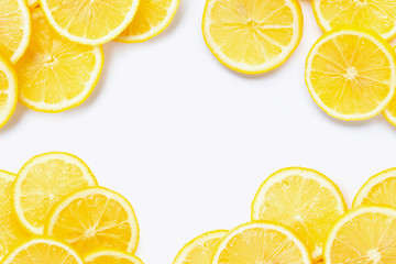 Obraz premium Frame made of fresh lemon with slices on white background.