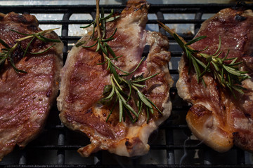 Pork Steaks With Rosemary Grilling on a Hot Barbecue
