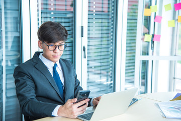 Fototapeta premium young Asian businessman is liaising with shareholders about his growth and progress. Business Success Concepts