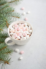 Cup of hot chocolate with marshmallows on a gray concrete background. Christmas concept.