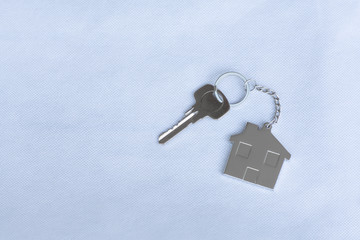House key with home keyring in on white background
