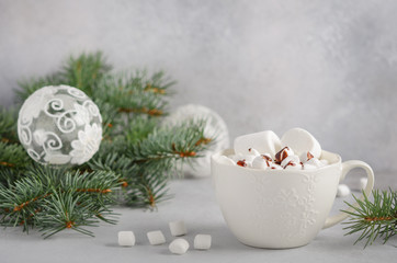 Cup of hot chocolate with marshmallows on a gray concrete background. Christmas concept.