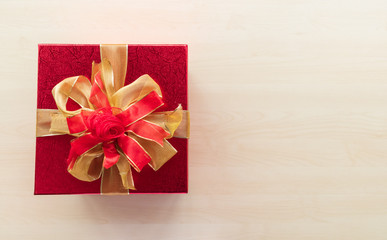 Gift box and Santa Claus hat on the table