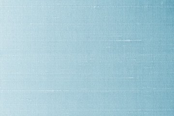 Blue silk fabric background of satin texture cotton cloth pattern with shiny gradient silky woven detail