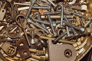 Screws background. heap of tapping screws. work tool. pile of fasteners. bolts and nuts. metal scrape