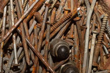 Screws background. heap of tapping screws. pile of fasteners