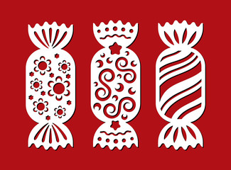 Set of Christmas sweets. Template candy for laser cutting, wood carving. Vector silhouette bonbon on red background. Openwork toy with cutout lace ornament. Decorative icons with flower, star, curl.