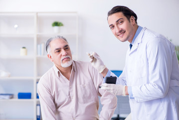 Male patient with hearing problem visiting doctor otorhinolaryng