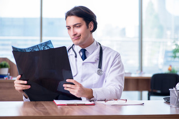 Young male doctor radiologist working in the clinic