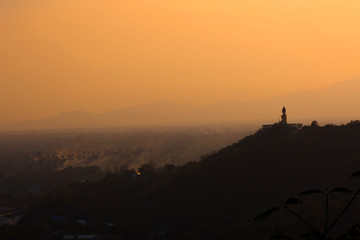 Landscape view sunset of Buddha statue on the mountain