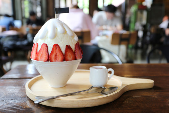 Closeup of strawberry bingzu with milk snow ice on the table in restaurant