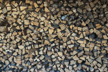 Old woodpile of pine and birch firewood in Siberia