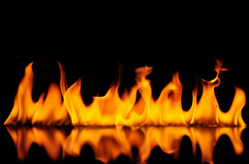 The flame on the black background has a shadow of the flame.