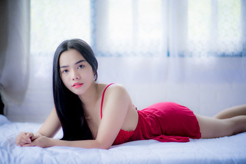Asian girl in red pyjamas