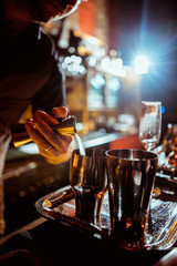 process of preparing a cocktail bartender