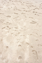 Foot prints on the shore sand