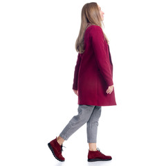 Woman in red coat walking goes looking autumn on white background isolation