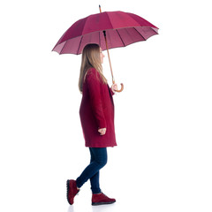 Woman in red coat standing with umbrella looking autumn cold rain