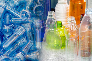 The abstract scene of the preform shape and the various type of plastic drinking water bottle products. The various type of PET bottles container products manufacturing concept .