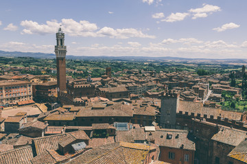 Panoramic view of Siena city with Piazza del Campo and the Torre del Mangia