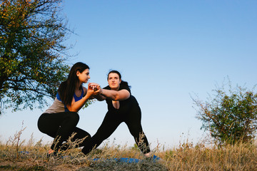 Overweight woman doing lateral lunges