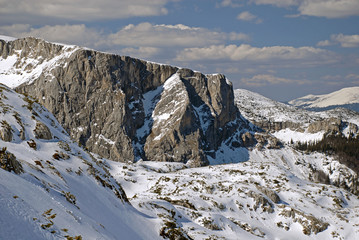 Fototapeta na wymiar Mountain in winter covered with snow