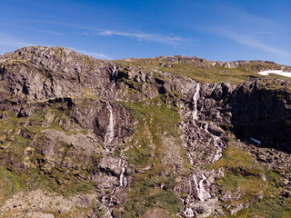 Waterfall in mountains. Norwegian route Sognefjellet