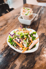 Fresh Salad In A Bowl On A Wooden Table