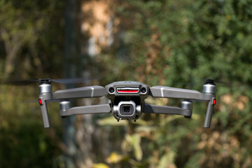 drone quad copter with high resolution digital camera on the sky