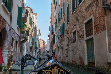 Fototapeta na wymiar Panoramic view of Venice narrow canal with historical buildings from gondola