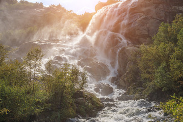 Panorama view of waterfall scene in mountains, national park of Dombay, Caucasus