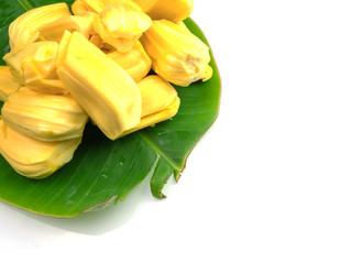 Fototapeta na wymiar Yellow jackfruit on banana leaf, isolated on white background