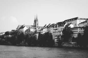 Naklejka premium View on Basel city and river Rhine, Switzerland. People swim in water