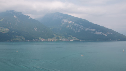 Obraz premium View on lake Thun and mountains from ship in city Spiez, Switzerland