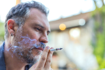 portrait of a man smoking cigarette