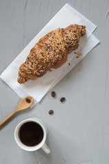 Top view of croissant and coffee