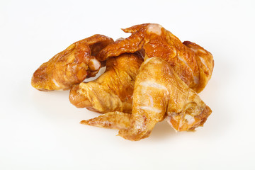 Smoked chicken wings over white background